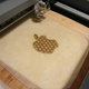 Image for article titled Laser-Cut Apple Apple Mac Mini Pie Probably Runs On Vanilla OS X Ice Cream